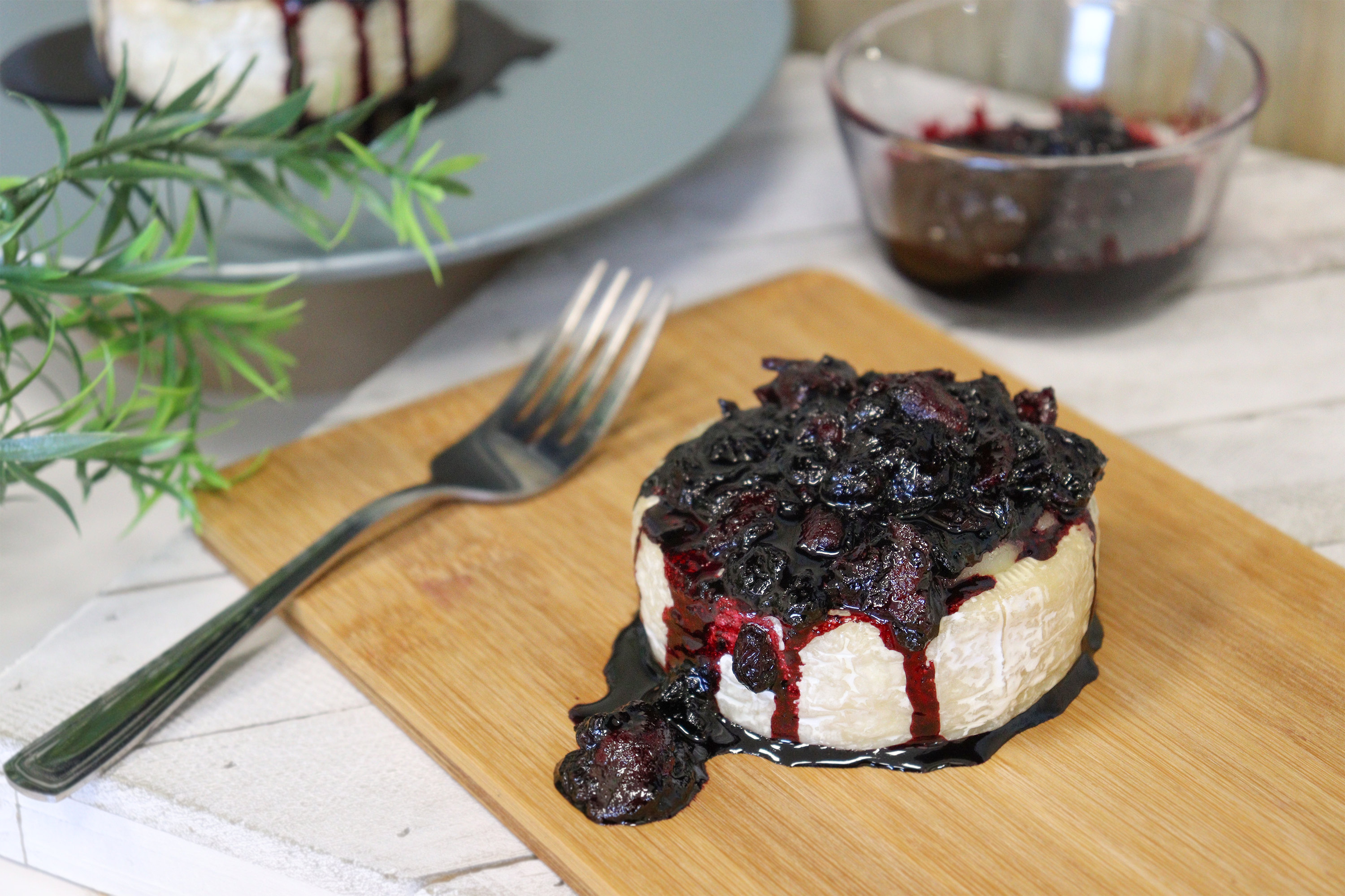 Baked brie cheese topped with bacon & haskap berries
